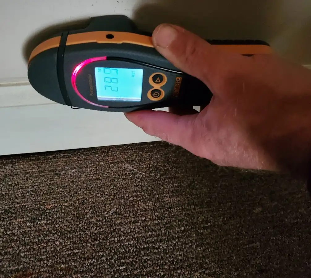 Moisture detection at baseboard during Storm Damage Restoration in Alsip